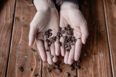 High angle view of hands holding ice cream