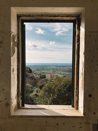 Landscape or scenic view seen through window. tuscany, italy 