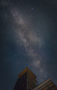 Low angle view of building against sky at night