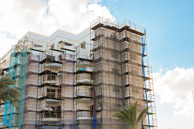 Low angle view of modern buildings against sky