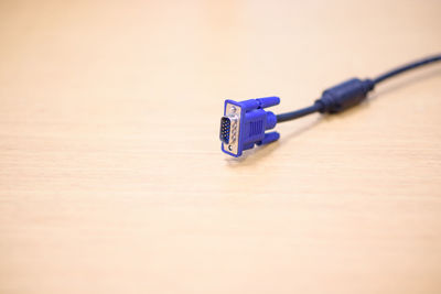 Close-up of blue cable on table