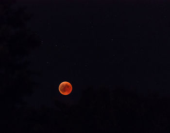 Low angle view of moon against sky at night