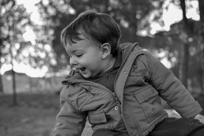 Rear view of boy looking at winter