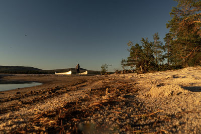 Scenic view of field against clear blue sky