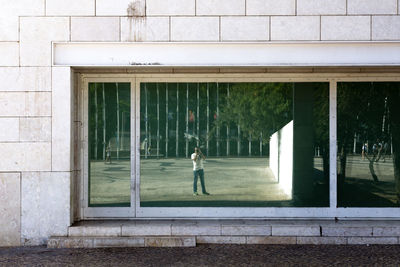 Woman standing in front of building