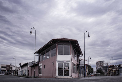 Street amidst buildings against sky in city