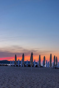 Scenic view of sea against clear sky during sunset