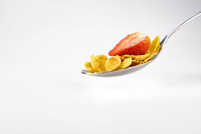 Close-up of fruit against white background