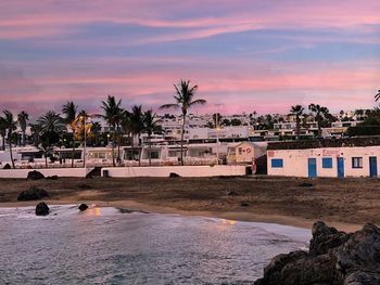 Scenic view of beach against sky during sunset