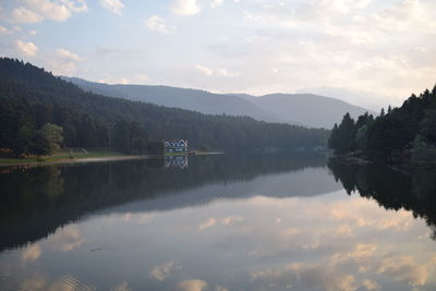 Scenic view of lake against sky during sunset