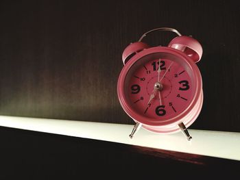 Close-up of clock on table