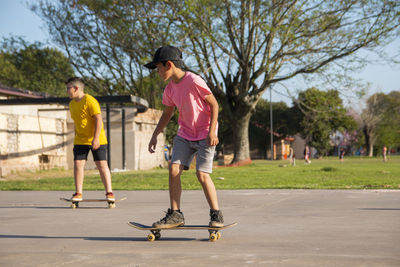 Little boys skateboarding