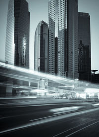 Blurred motion of illuminated buildings in city