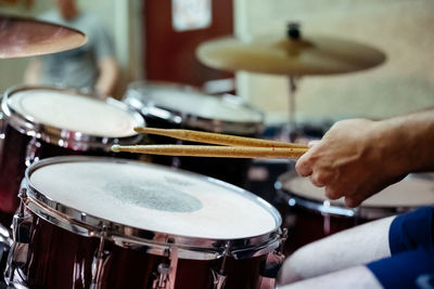 Midsection of man playing piano at music concert