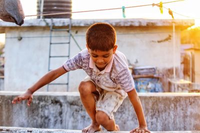 Rear view of boys playing in water