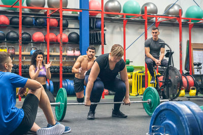 Portrait of man exercising in gym