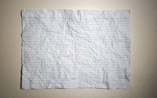 High angle view of empty paper on bed