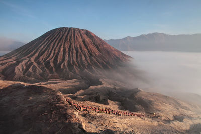 Panoramic view of volcanic landscape against sky