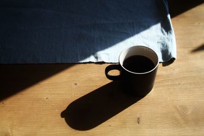 High angle view of coffee cup on table