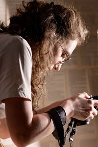 Side view of young woman looking away