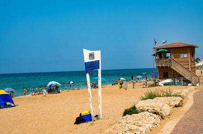 Scenic view of beach against clear sky