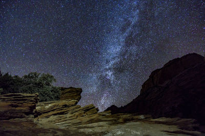 Scenic view of star field against sky at night