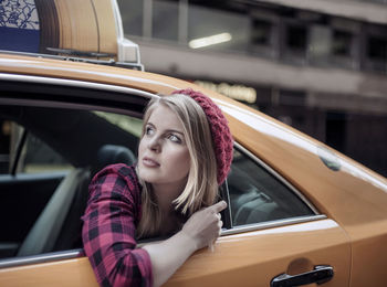 Portrait of woman sitting in car