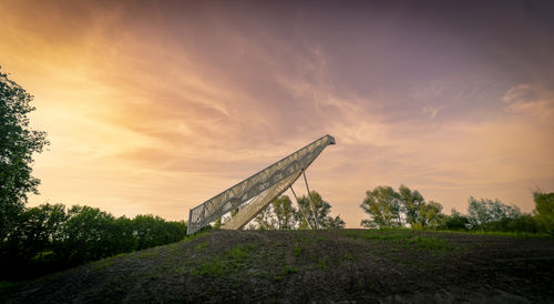 Low angle view of building against sky during sunset