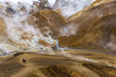 Panoramic view of people on land