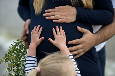 Pregnant woman with family