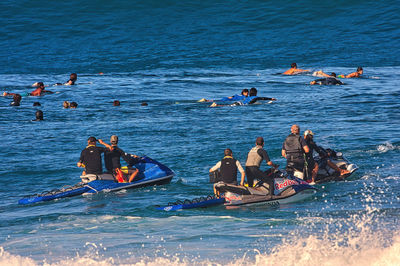 People enjoying in sea