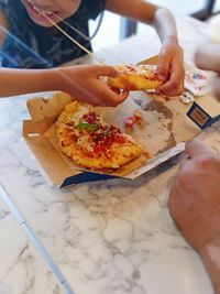 Close-up of hand eating food