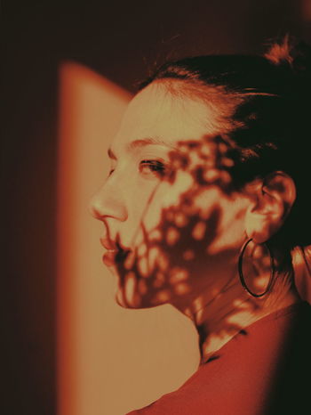 Close-up of young woman looking away