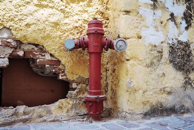 Fire hydrant against wall