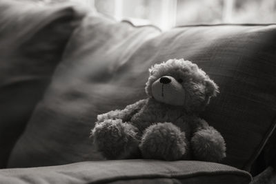 Close-up of stuffed toy on sofa at home