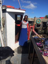 Woman standing in boat