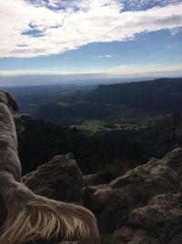 Scenic view of mountains against cloudy sky