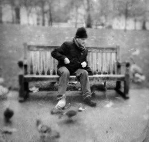 Full length of man sitting in park