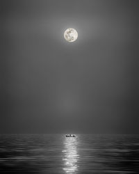 Scenic view of sea against sky at night