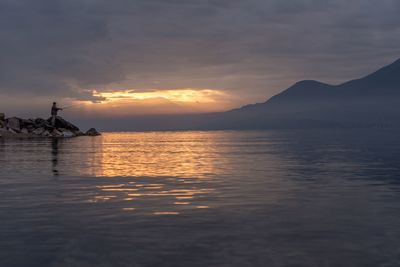 Scenic view of sea against cloudy sky