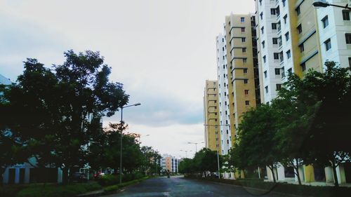 Road along buildings in city