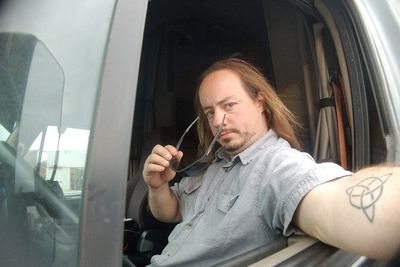 Portrait of man wearing sunglasses while sitting in car