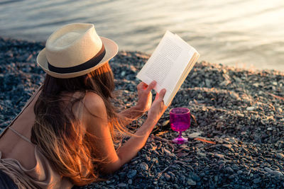 Woman wearing hat on beach