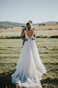 Rear view of woman with umbrella