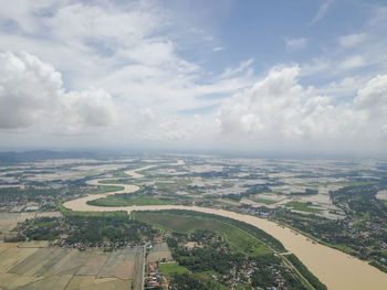 High angle view of river amidst landscape against sky