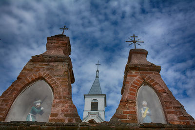 Low angle view of bell tower against sky