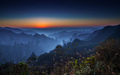 Scenic view of mountains against sky during sunset