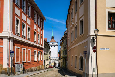 Narrow street along buildings