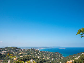 Scenic view of sea against clear blue sky