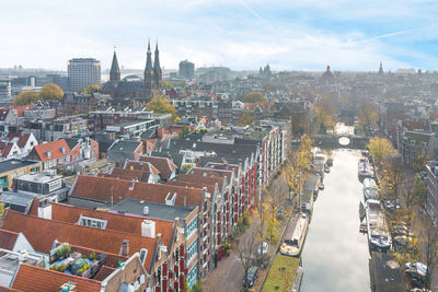 High angle view of city buildings against sky